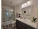 Well-lit bathroom with a shower and modern vanity offering a fresh and inviting space at 1978 Lockett Ln, The Villages, FL 34762