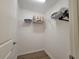 Clean, organized closet with shelves stocked with linens and hangers for ample storage space at 1978 Lockett Ln, The Villages, FL 34762