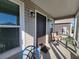 Inviting front porch with comfortable seating and stylish outdoor lighting for evening enjoyment at 1978 Lockett Ln, The Villages, FL 34762