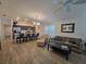 Open-concept living space connecting the kitchen, dining, and living areas for seamless entertaining at 1978 Lockett Ln, The Villages, FL 34762