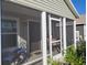 Cozy screened porch with outdoor seating perfect for relaxing and enjoying the outdoors at 1978 Lockett Ln, The Villages, FL 34762