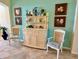 Charming dining area with a hutch, decorative accents and light blue accent wall at 1985 Abordale Ln, The Villages, FL 32162