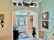 Welcoming entryway with a decorative front door and transom windows at 1985 Abordale Ln, The Villages, FL 32162