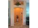 Charming entryway featuring an art niche, decorative statue and archway to the next room at 1985 Abordale Ln, The Villages, FL 32162