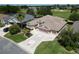 Beautiful house with a lush green lawn, decorative driveway, and a two-car garage at 1985 Abordale Ln, The Villages, FL 32162