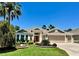 Charming single-story home featuring a well-manicured lawn, mature landscaping, and a three-car garage at 1985 Abordale Ln, The Villages, FL 32162