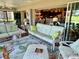 Bright sunroom featuring comfortable seating and an open view to the kitchen at 1985 Abordale Ln, The Villages, FL 32162