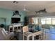 Comfortable living room with built-in shelving, TV, and stylish decor at 1985 Abordale Ln, The Villages, FL 32162