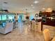 Open living space with dining area, kitchen and modern appliances at 1985 Abordale Ln, The Villages, FL 32162