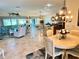 Open-concept living space with dining area, kitchen, and comfortable seating at 1985 Abordale Ln, The Villages, FL 32162
