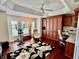 Office space with hardwood floors, a ceiling fan, and custom built-in cabinets with a desk at 1985 Abordale Ln, The Villages, FL 32162