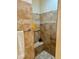 Tiled walk-in shower with built-in bench and convenient grab bars for accessibility at 1985 Abordale Ln, The Villages, FL 32162