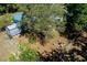 View of the spacious backyard featuring a shed, fire pit, and fencing at 201 W Mirror Lake Dr, Fruitland Park, FL 34731