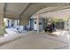 Large open carport with space for golf cart and direct access to the home's side door at 201 W Mirror Lake Dr, Fruitland Park, FL 34731