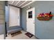 Charming entrance with dual welcome mats and colorful flower basket at 201 W Mirror Lake Dr, Fruitland Park, FL 34731