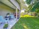 Back porch with a view of the green backyard, shed, and landscaping at 203 Se 30Th Ave, Ocala, FL 34471