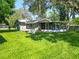 An expansive backyard with green lawn, providing ample space for outdoor activities and gatherings at 203 Se 30Th Ave, Ocala, FL 34471