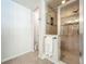 Bright bathroom featuring a glass shower, neutral tile, and fresh paint at 203 Se 30Th Ave, Ocala, FL 34471