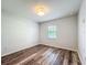 Bedroom with wood-look floors, a single window, and light gray walls at 203 Se 30Th Ave, Ocala, FL 34471