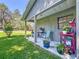 Cozy front porch with seating and colorful potted plants at 203 Se 30Th Ave, Ocala, FL 34471