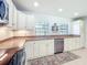 Beautiful kitchen with stainless steel appliances, white cabinetry, and stylish countertops, perfect for cooking at 203 Se 30Th Ave, Ocala, FL 34471