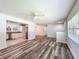 Bright open-concept living space featuring modern flooring, a seamless transition to the kitchen, and ample natural light at 203 Se 30Th Ave, Ocala, FL 34471