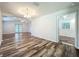 Spacious living room featuring wood-look flooring, ceiling fan, and recessed lighting at 203 Se 30Th Ave, Ocala, FL 34471