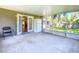 This screened porch features double doors to the home and backyard access at 203 Se 30Th Ave, Ocala, FL 34471
