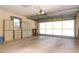 Well-lit two-car garage with storage cabinets and an automatic door opener at 20631 Prince Ranier Pl, Leesburg, FL 34748