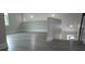 A bonus room with vinyl floors and a half-wall leading to a staircase at 217 S East St, Leesburg, FL 34748