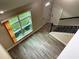 Bright foyer features a window and tiled floor near the staircase and front door at 217 S East St, Leesburg, FL 34748