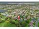 Aerial view showcases the home's prime location within a vibrant, lakeside community at 2259 Lockwood Loop, The Villages, FL 32162