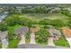 Aerial view showcasing the homes and lush landscaping in a well-maintained community at 2259 Lockwood Loop, The Villages, FL 32162