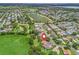 Aerial view of home in a scenic community with lake views and lush landscaping at 2259 Lockwood Loop, The Villages, FL 32162