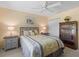 Bedroom with a fan, carpet, neutral paint, and dark wood bookcase at 2259 Lockwood Loop, The Villages, FL 32162