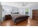 Bedroom with wood floors, a window with natural light, and light blue walls at 2259 Lockwood Loop, The Villages, FL 32162
