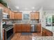 Beautiful kitchen featuring stainless steel appliances, granite counters, and stone backsplash at 2259 Lockwood Loop, The Villages, FL 32162