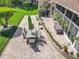Spacious yard with patio, green lawn, and lush greenery with seating at 24436 Madewood Ave, Leesburg, FL 34748