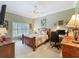 Bedroom featuring warm carpet, accent lighting, and furniture at 24436 Madewood Ave, Leesburg, FL 34748