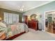 Spacious primary bedroom featuring ensuite bath and walk-in closet at 24436 Madewood Ave, Leesburg, FL 34748