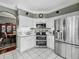 Modern kitchen showcasing stainless steel appliances and white cabinets at 24436 Madewood Ave, Leesburg, FL 34748