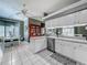 Bright kitchen featuring stainless steel appliances and a dining area with great natural light at 24436 Madewood Ave, Leesburg, FL 34748