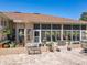 Relax on the open patio area with brick pavers and space for seating and potted plants at 24436 Madewood Ave, Leesburg, FL 34748