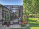 Screened in lanai with tiled floor and exterior view to the backyard at 25523 Maurepas Ln, Leesburg, FL 34748