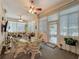 Sunroom featuring wicker furniture, carpet flooring, many windows with blinds, and lots of natural light at 25523 Maurepas Ln, Leesburg, FL 34748