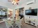 Enclosed sunroom with ceiling fan and multiple views to other living spaces at 25523 Maurepas Ln, Leesburg, FL 34748