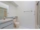 Bright bathroom with a shower, toilet and vanity area with ample counter space and storage at 26736 Cash Ct, Leesburg, FL 34748