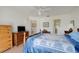 Comfortable bedroom with wood furnishings, neutral walls, and natural light creating a relaxing atmosphere at 26736 Cash Ct, Leesburg, FL 34748