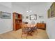Dining area featuring a wooden table and chairs with view to the furnishings at 26736 Cash Ct, Leesburg, FL 34748
