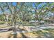 Community horseshoe pit with benches offers a recreational space with lake views for residents to enjoy at 26736 Cash Ct, Leesburg, FL 34748